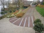 Oprit en tuin met mooie belijning